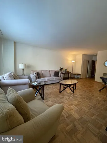 a living room with furniture and a rug