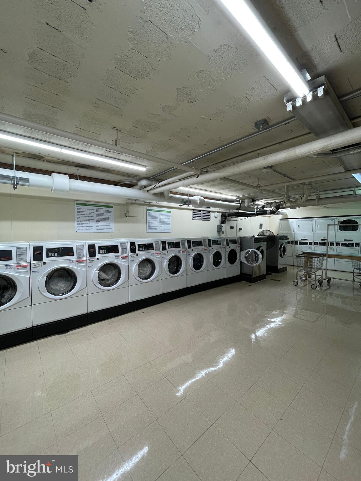 2475 Virginia Avenue Northwest, Unit 411 Washington, DC 20037 - Photo 5 of 20 a utility room with stainless steel appliances and stove