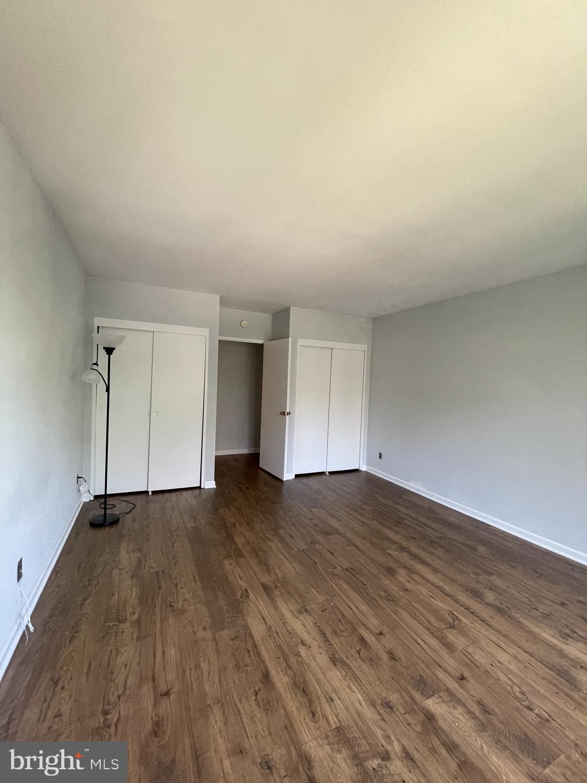 2475 Virginia Avenue Northwest, Unit 411 Washington, DC 20037 - Photo 6 of 20 a view of an empty room with wooden floor and closet