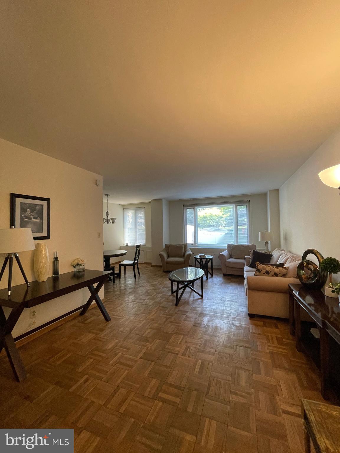2475 Virginia Avenue Northwest, Unit 411 Washington, DC 20037 - Photo 8 of 20 a living room with furniture and a window