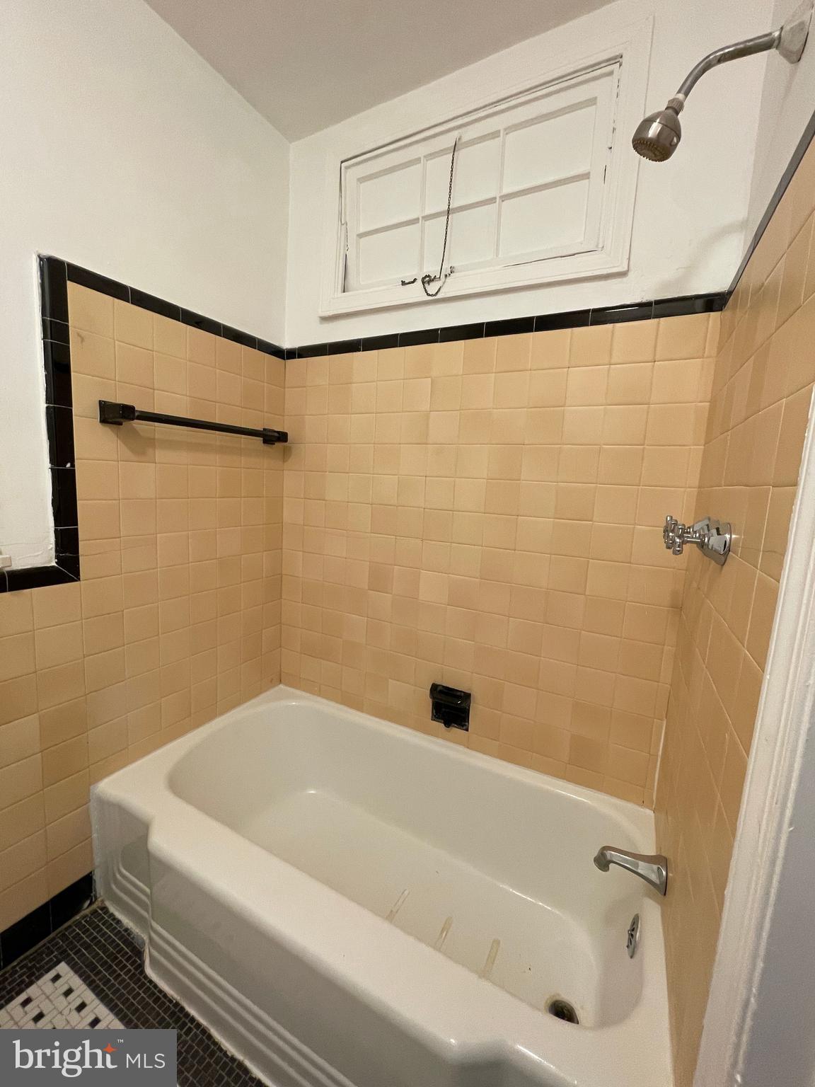 2475 Virginia Avenue Northwest, Unit 411 Washington, DC 20037 - Photo 10 of 20 a bathroom with a white bath tub and a shower