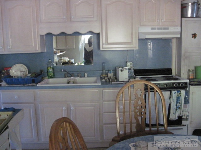 958 C Deep Ford Road Lansing, NC 28643 - Photo 4 of 5 a kitchen with a sink and cabinets