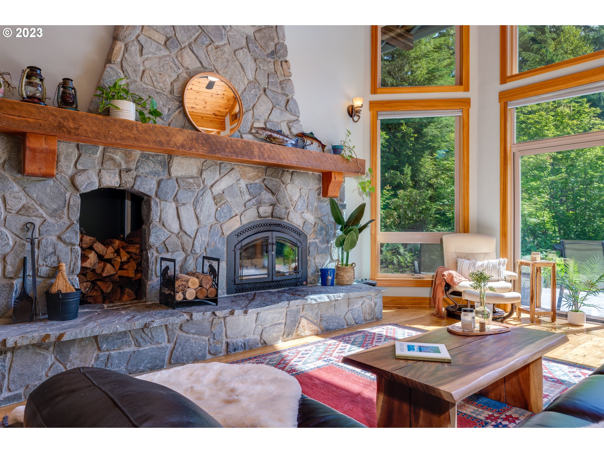 20715 East Glacier View Road Rhododendron, OR 97049 - Photo 11 of 41 a living room with fireplace furniture and a fireplace