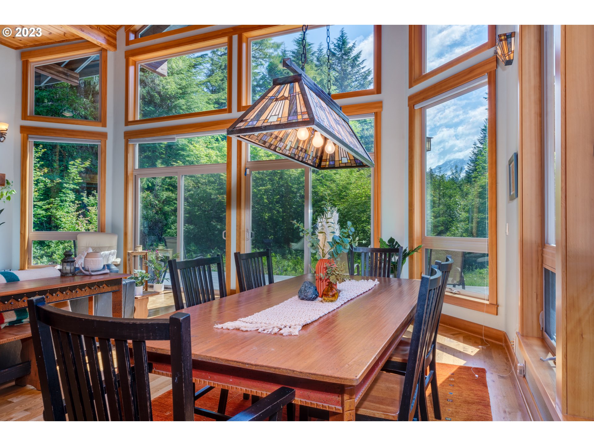20715 East Glacier View Road Rhododendron, OR 97049 - Photo 17 of 41 a view of a dining room with furniture window and outside view