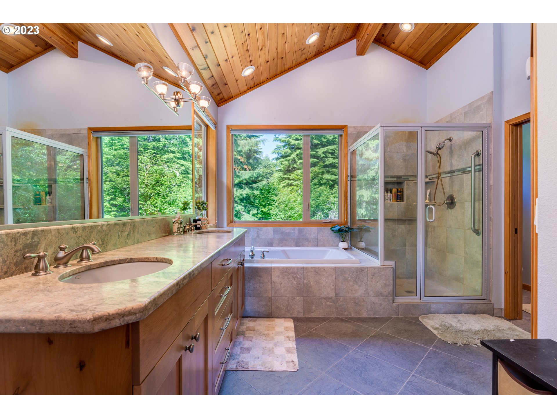 20715 East Glacier View Road Rhododendron, OR 97049 - Photo 23 of 41 a bathroom with a granite countertop sink and a large window