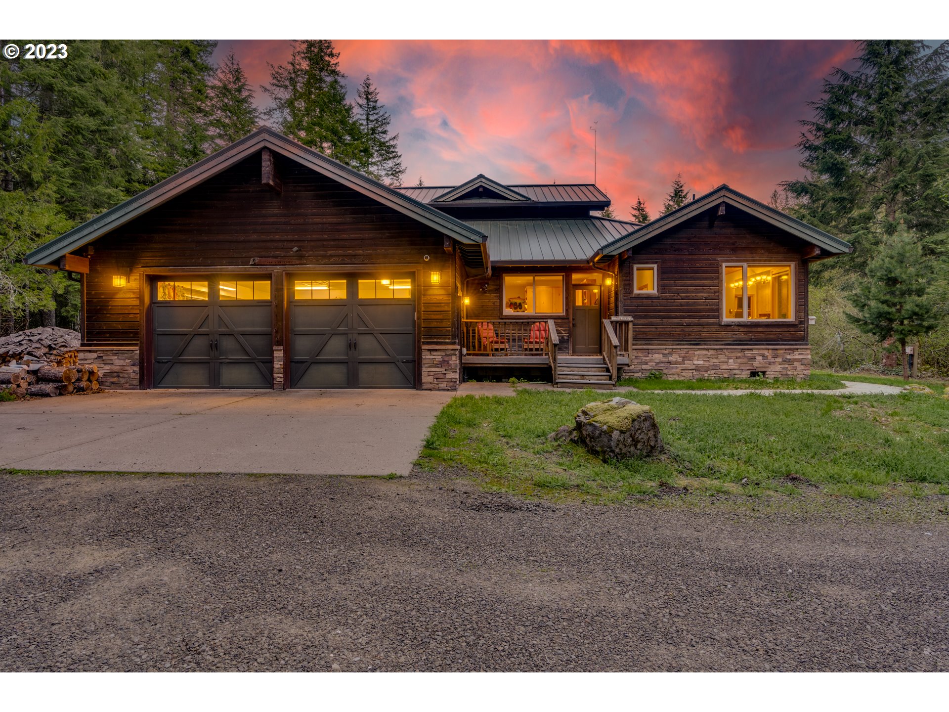 20715 East Glacier View Road Rhododendron, OR 97049 - Photo 3 of 41 a view of a yard in front of a house with a yard