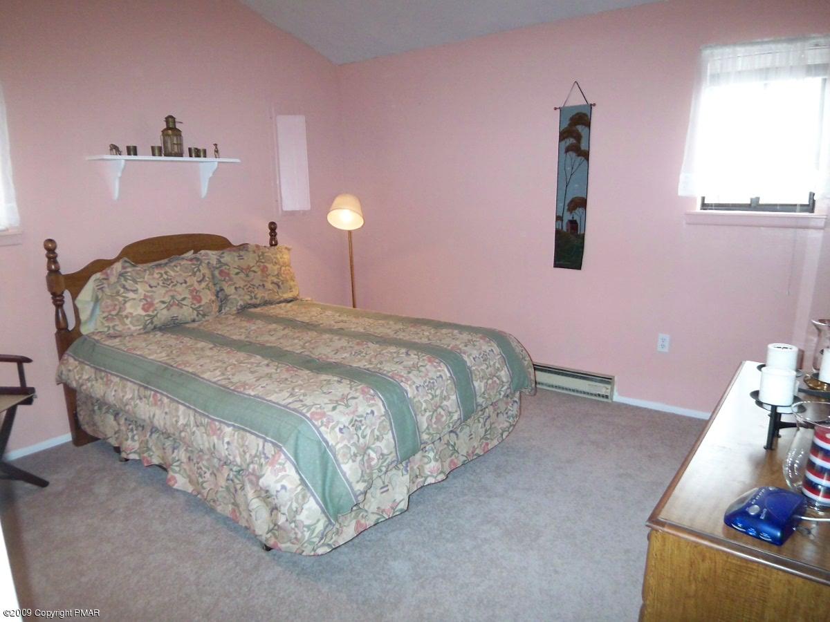 BEDROOM WITH VAULTED CEILING