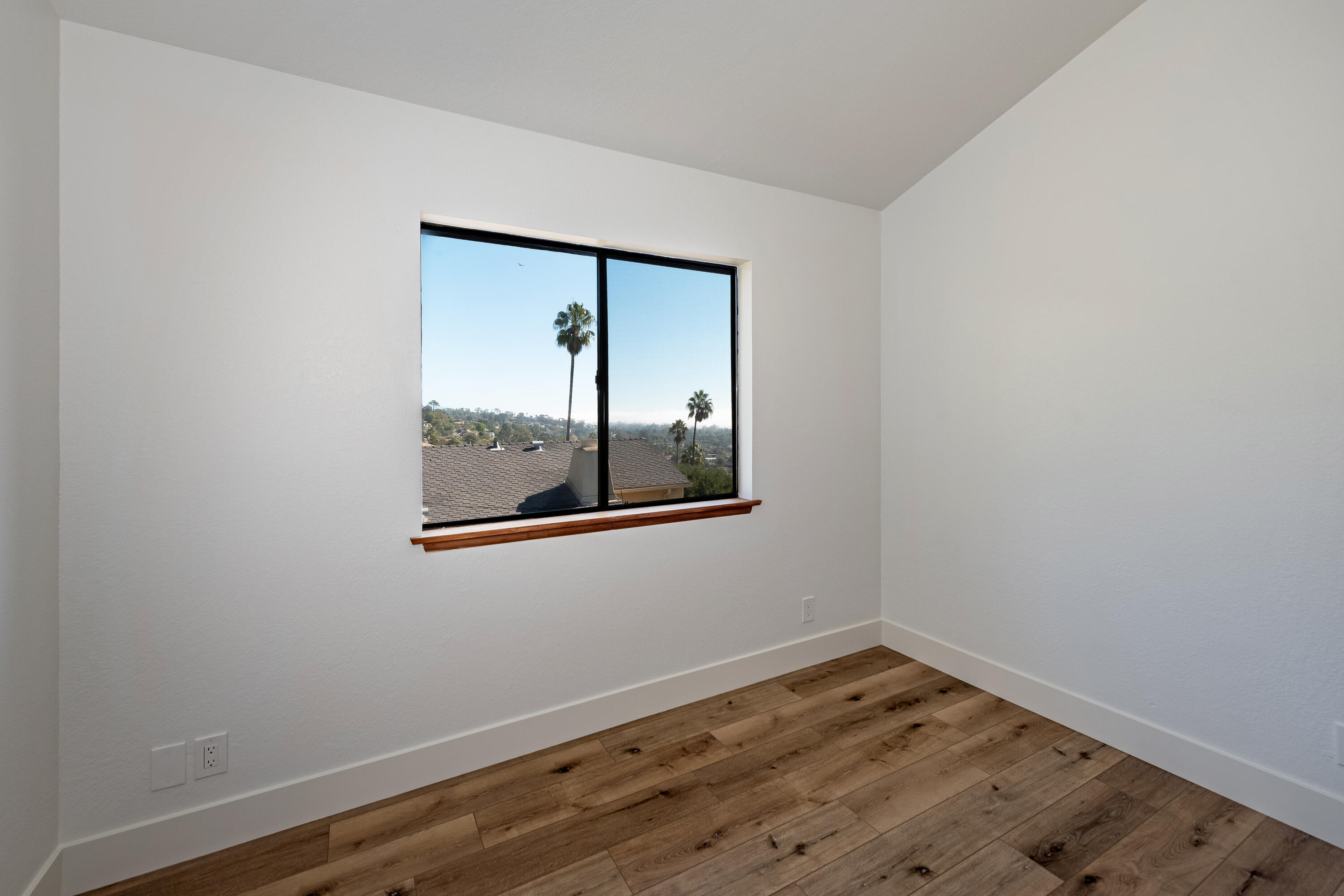 34 Rubio Road Santa Barbara, CA 93103 - Photo 10 of 22 a view of empty room with wooden floor and fan