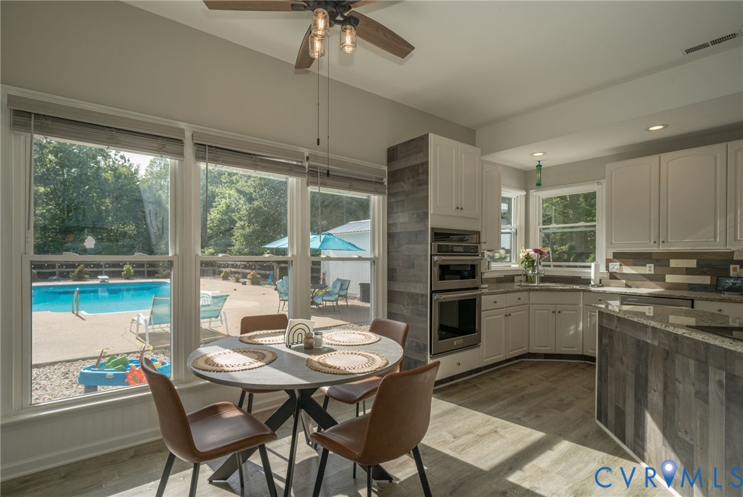 12700 Coalboro Road Chesterfield, VA 23838 - Photo 15 of 50 Kitchen with white cabinetry, stainless steel doub