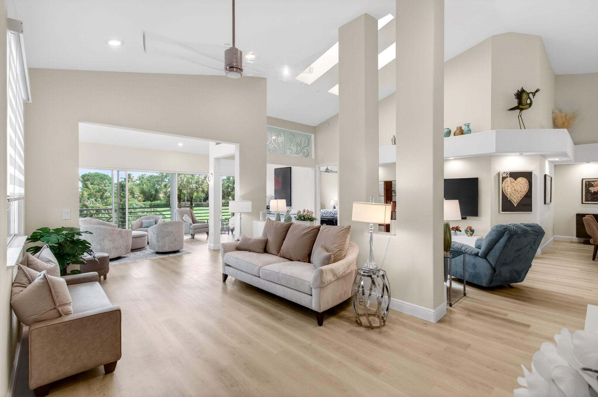 2530 Coco Plum Boulevard, Unit 1002 Boca Raton, FL 33496 - Photo 11 of 61 a living room with furniture and a large window