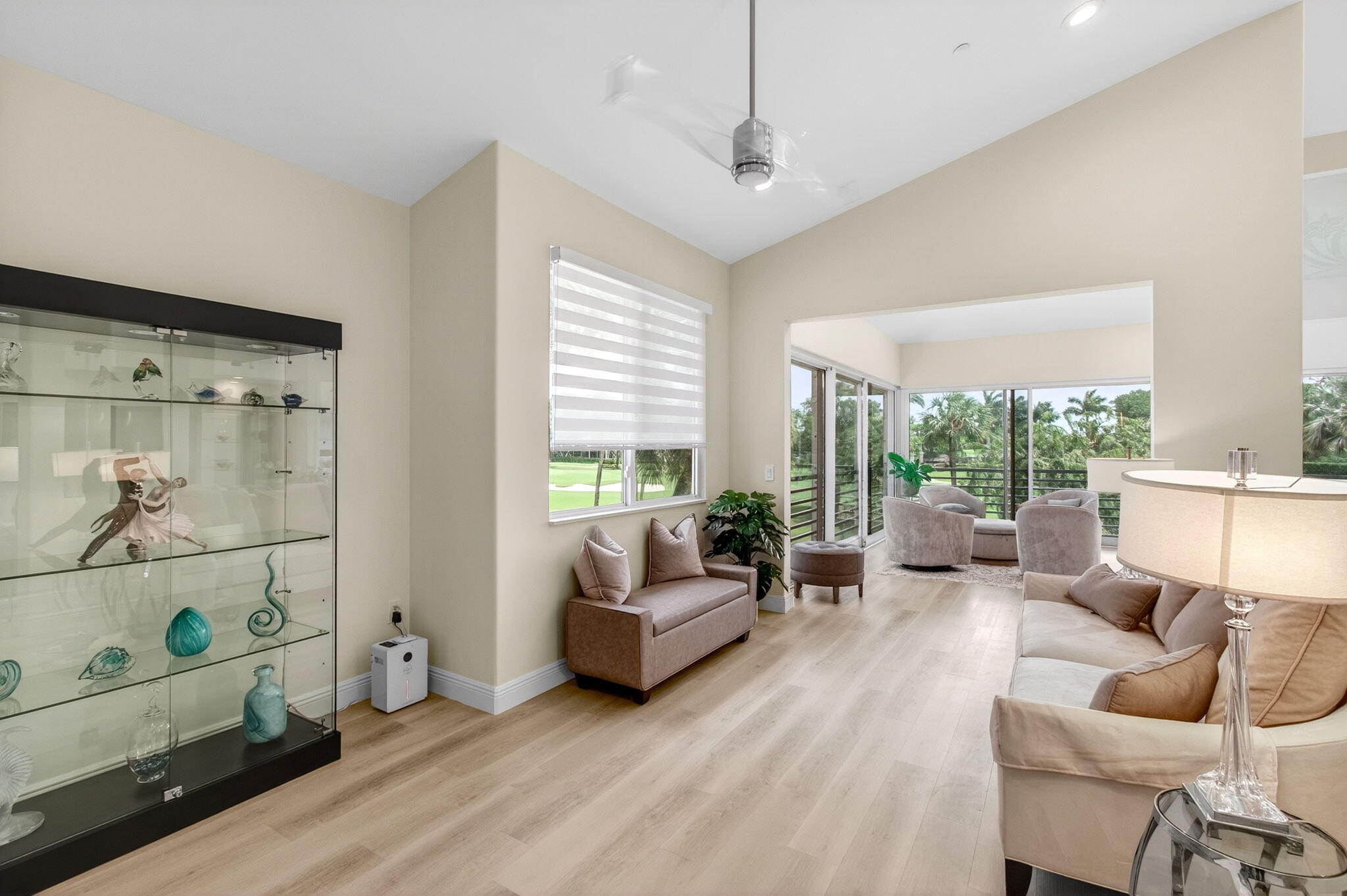 2530 Coco Plum Boulevard, Unit 1002 Boca Raton, FL 33496 - Photo 12 of 61 a living room with furniture and a large window