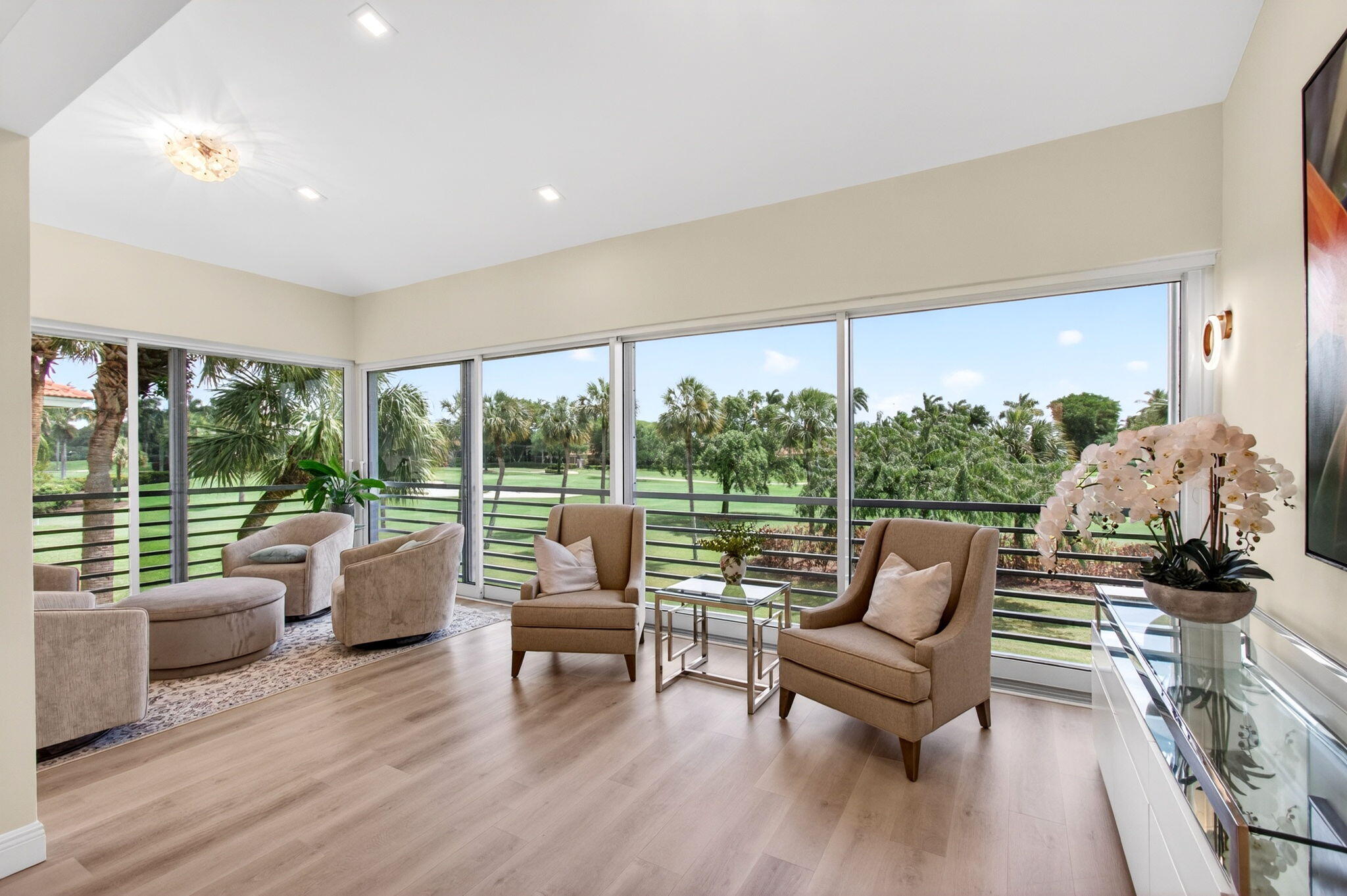 2530 Coco Plum Boulevard, Unit 1002 Boca Raton, FL 33496 - Photo 14 of 61 a living room with furniture and a large window