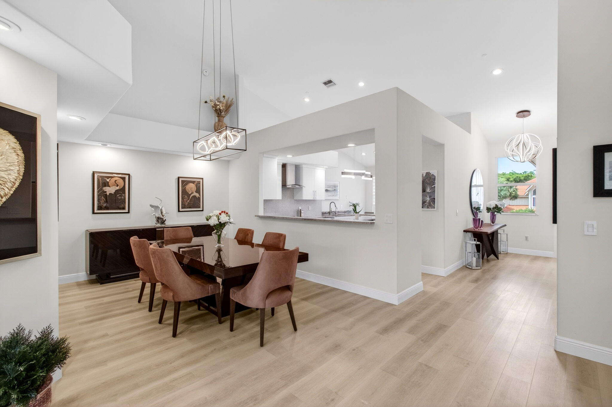 2530 Coco Plum Boulevard, Unit 1002 Boca Raton, FL 33496 - Photo 19 of 61 a view of a dining room with furniture and wooden floor