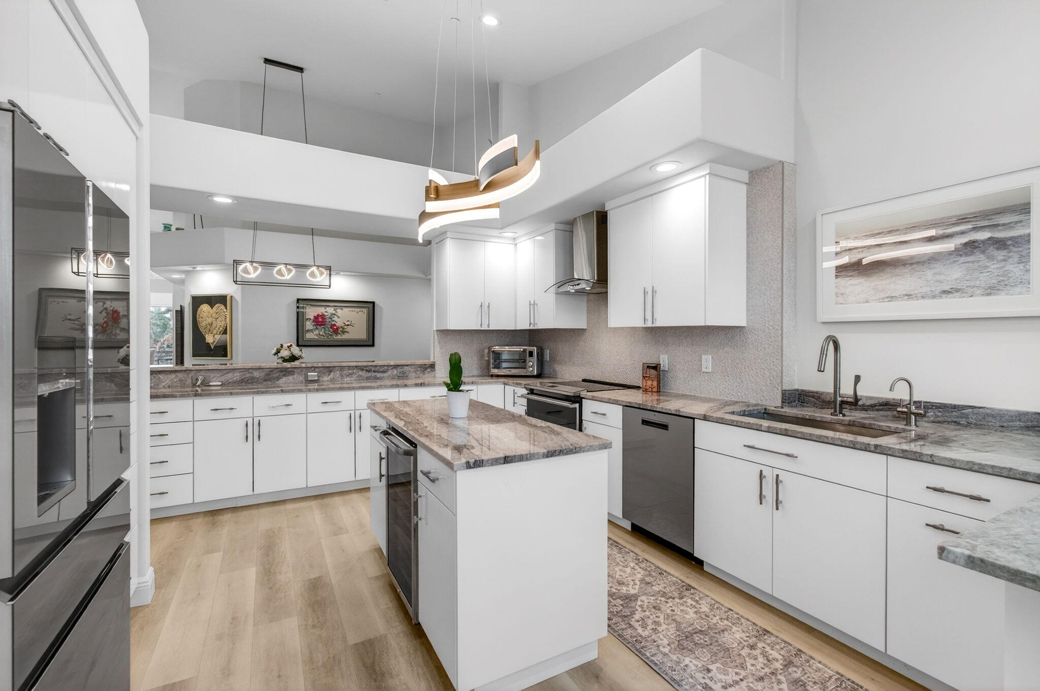 2530 Coco Plum Boulevard, Unit 1002 Boca Raton, FL 33496 - Photo 26 of 61 a kitchen with stainless steel appliances granite countertop a sink a stove and cabinets