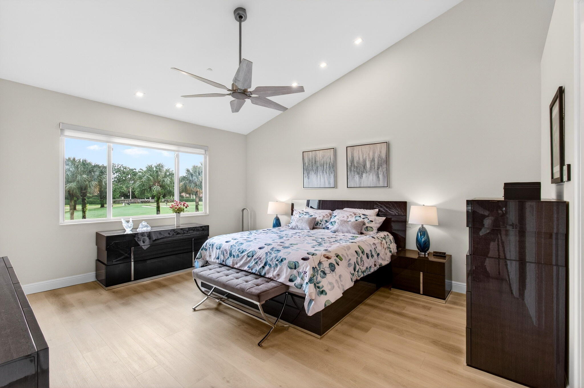 2530 Coco Plum Boulevard, Unit 1002 Boca Raton, FL 33496 - Photo 30 of 61 a bedroom with a large bed and a large window