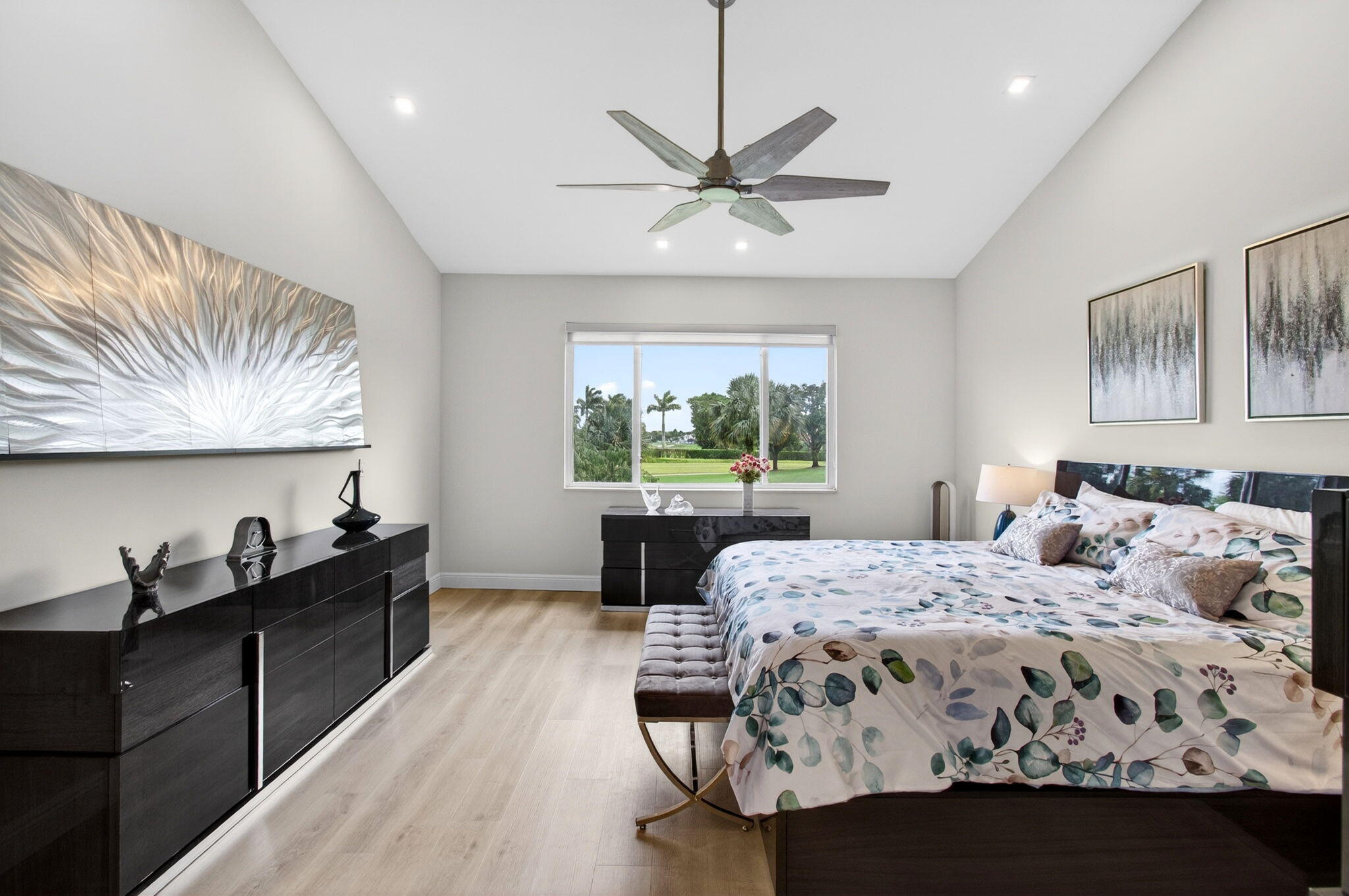 2530 Coco Plum Boulevard, Unit 1002 Boca Raton, FL 33496 - Photo 31 of 61 a bedroom with a bed and wooden floor