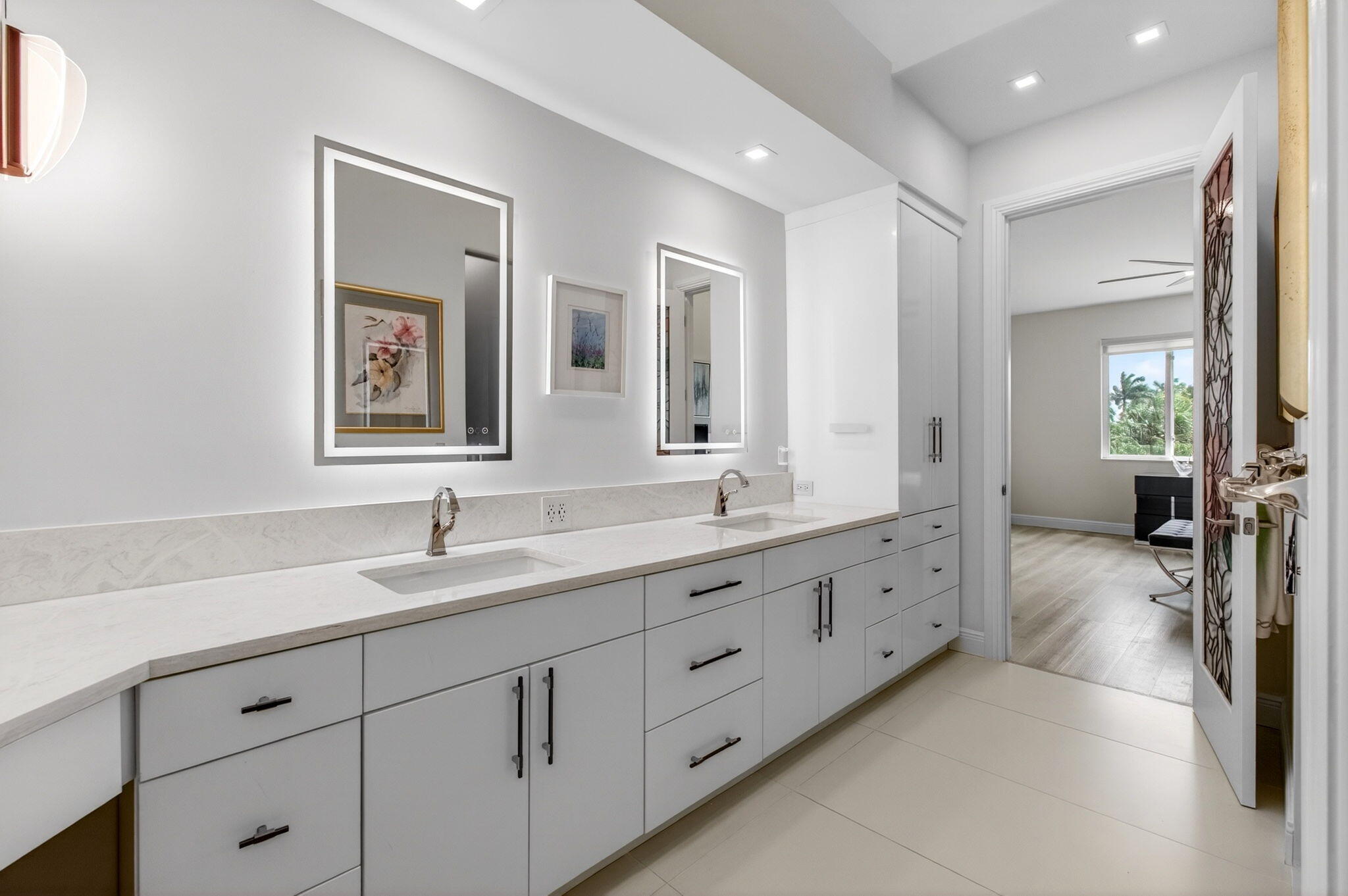 2530 Coco Plum Boulevard, Unit 1002 Boca Raton, FL 33496 - Photo 36 of 61 a spacious en suite bathroom with double sink and mirrors