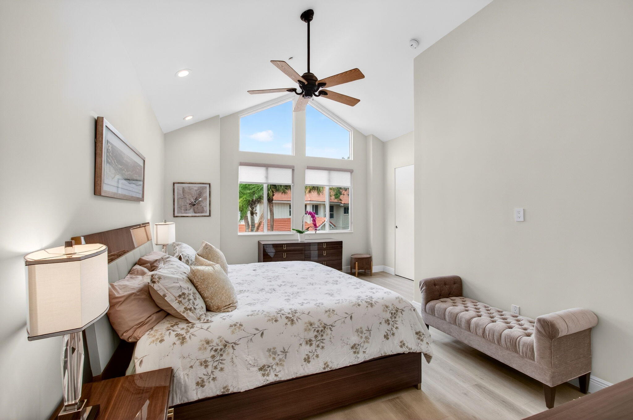 2530 Coco Plum Boulevard, Unit 1002 Boca Raton, FL 33496 - Photo 42 of 61 a bedroom with a bed and a chandelier