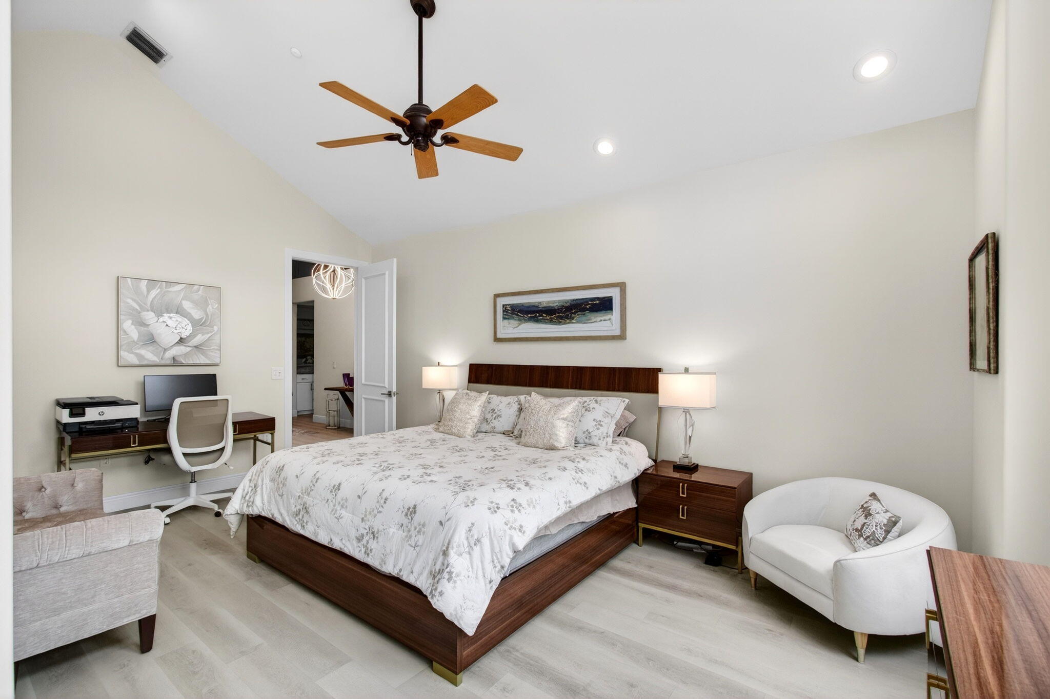 2530 Coco Plum Boulevard, Unit 1002 Boca Raton, FL 33496 - Photo 44 of 61 a bedroom with a bed and a couch