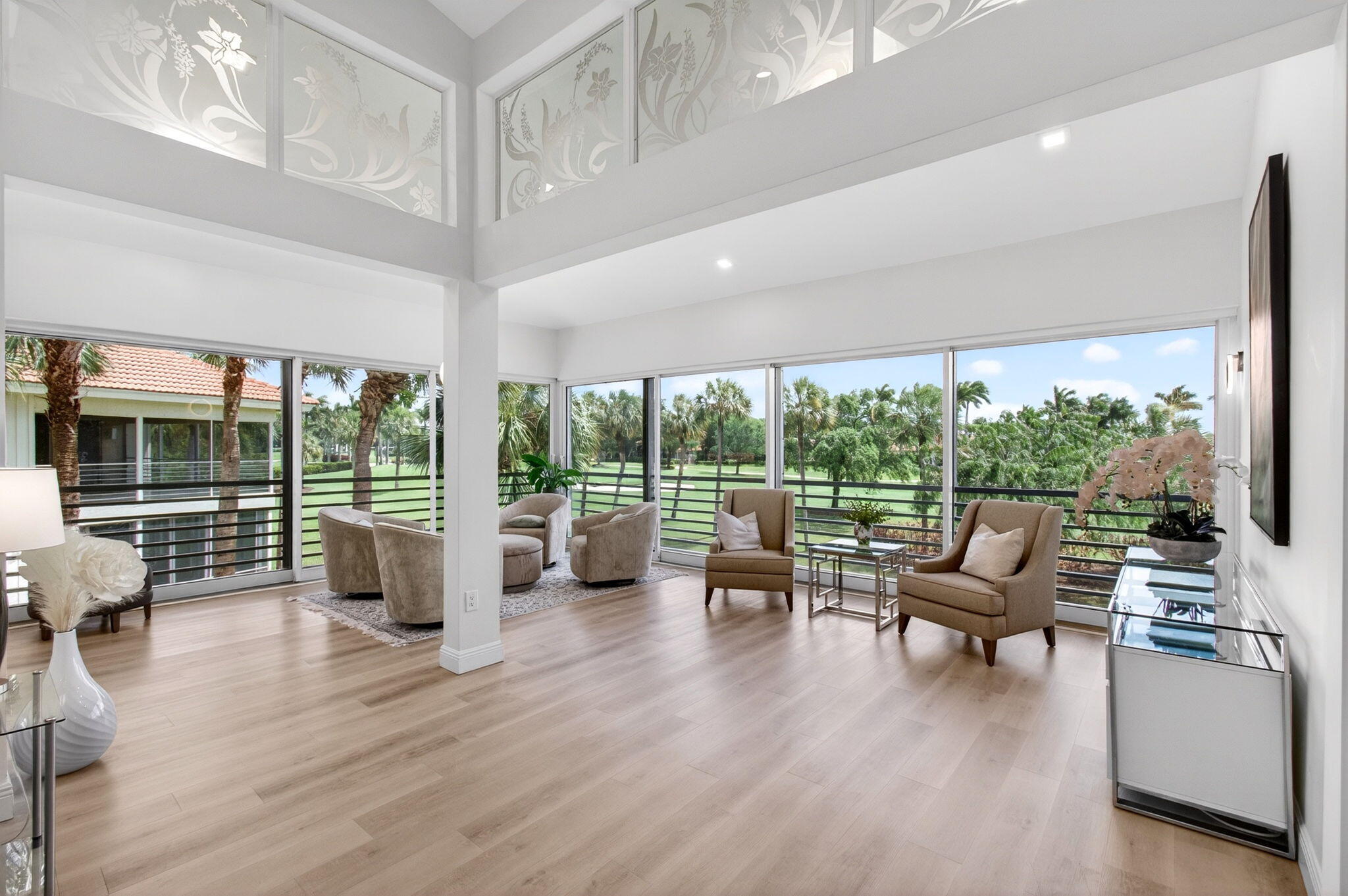 2530 Coco Plum Boulevard, Unit 1002 Boca Raton, FL 33496 - Photo 8 of 61 a living room with furniture and a large window