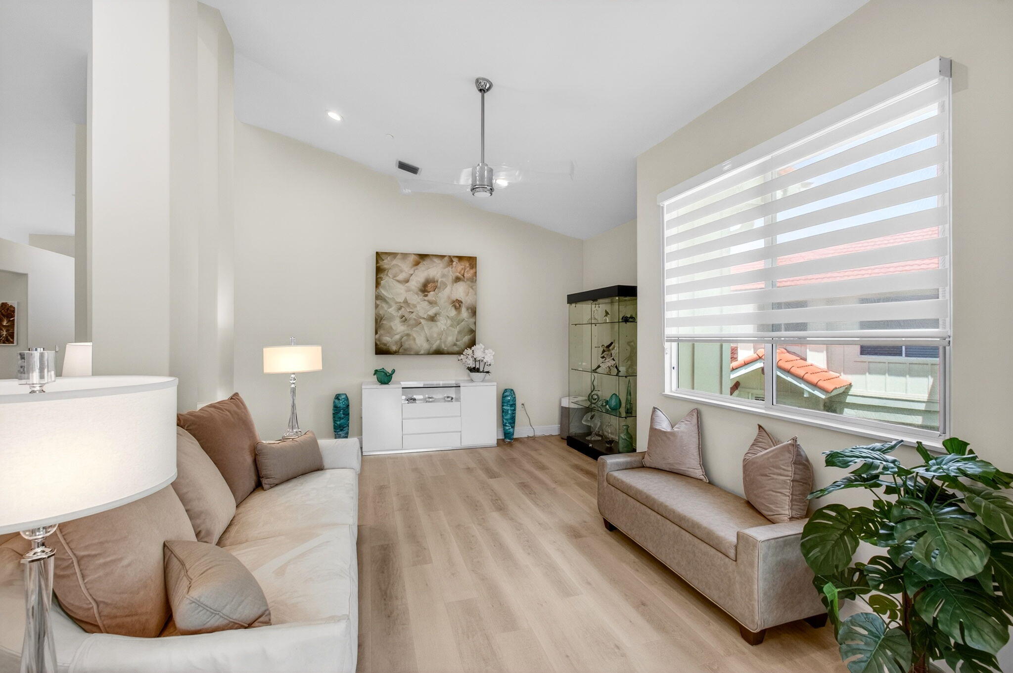 2530 Coco Plum Boulevard, Unit 1002 Boca Raton, FL 33496 - Photo 9 of 61 a living room with furniture and a large window