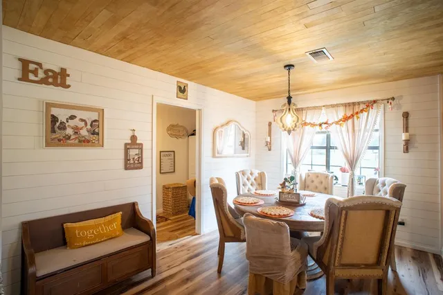 a dining room with furniture and window