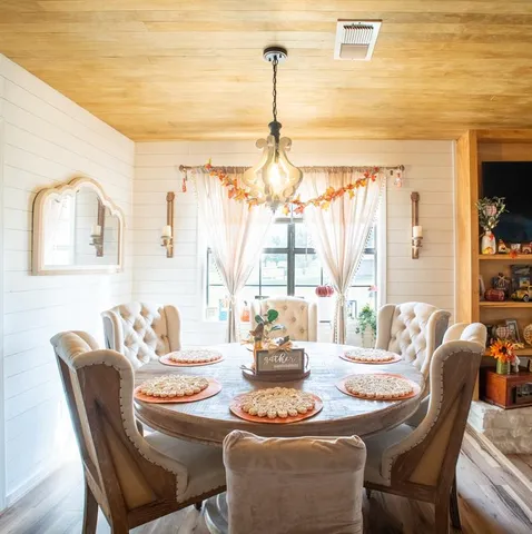 a kitchen with stainless steel appliances granite countertop a refrigerator a stove and a sink