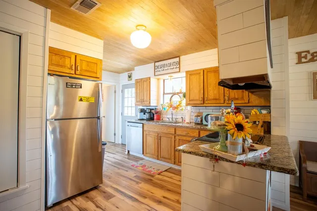 a kitchen with lots of counter top space and a window