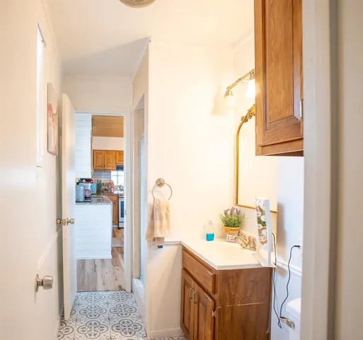 a bathroom with a sink and a mirror