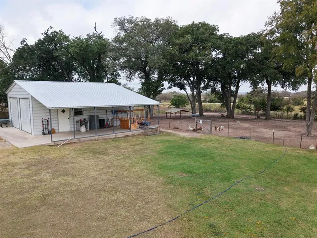 a house with trees in the background
