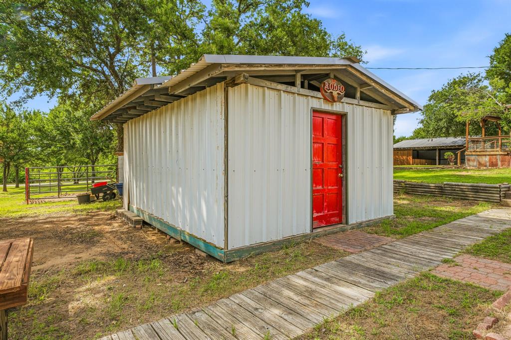 151 High Point Road Weatherford, TX 76088 - Photo 25 of 40 a view of a house with wooden fence