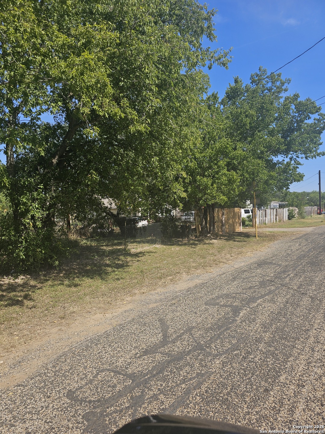 1511 Kayroe Road Adkins, TX 78101 - Photo 3 of 10 a view of dirt road with a building in the background