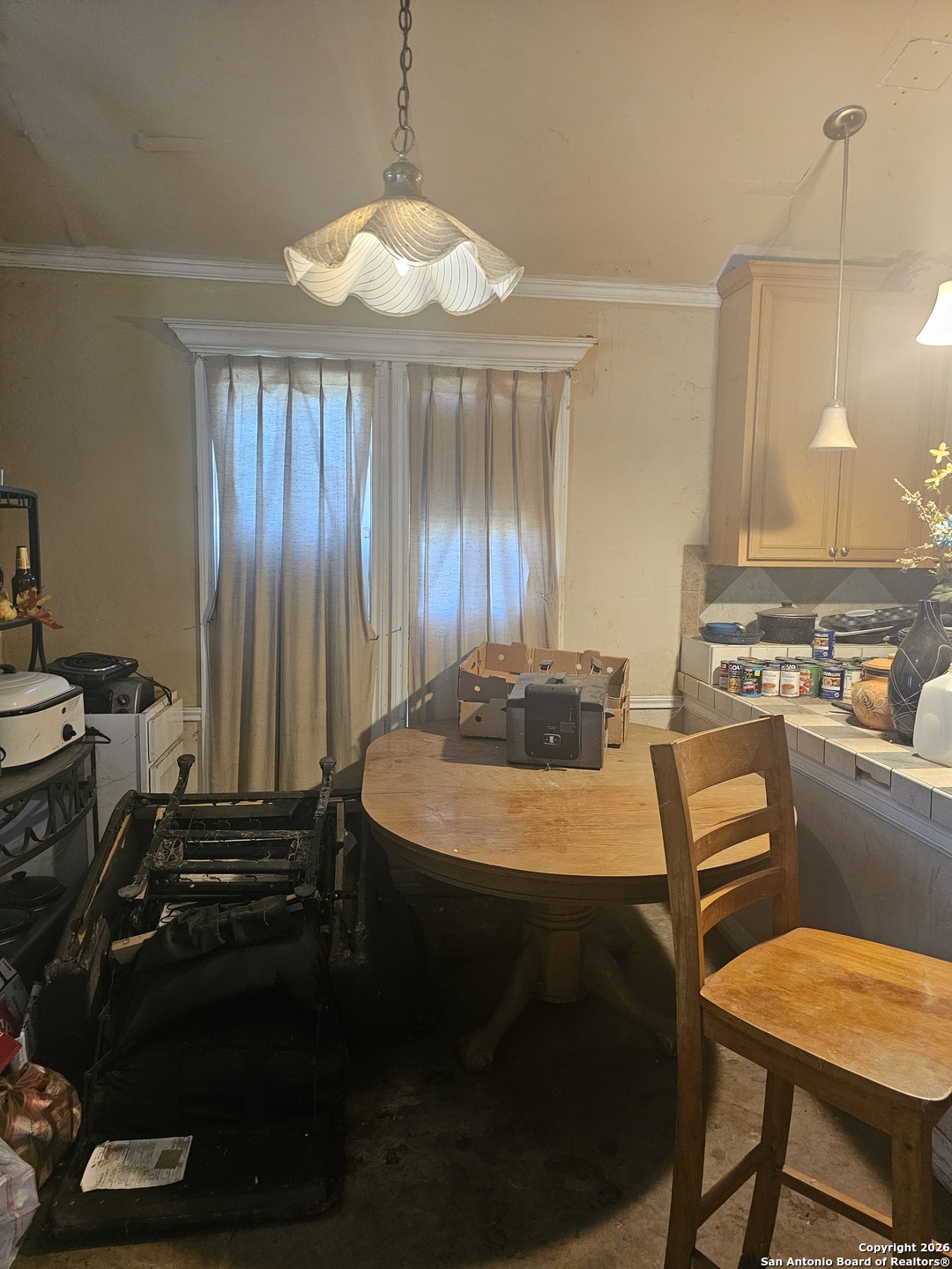 1511 Kayroe Road Adkins, TX 78101 - Photo 6 of 10 a room with table chairs and appliances