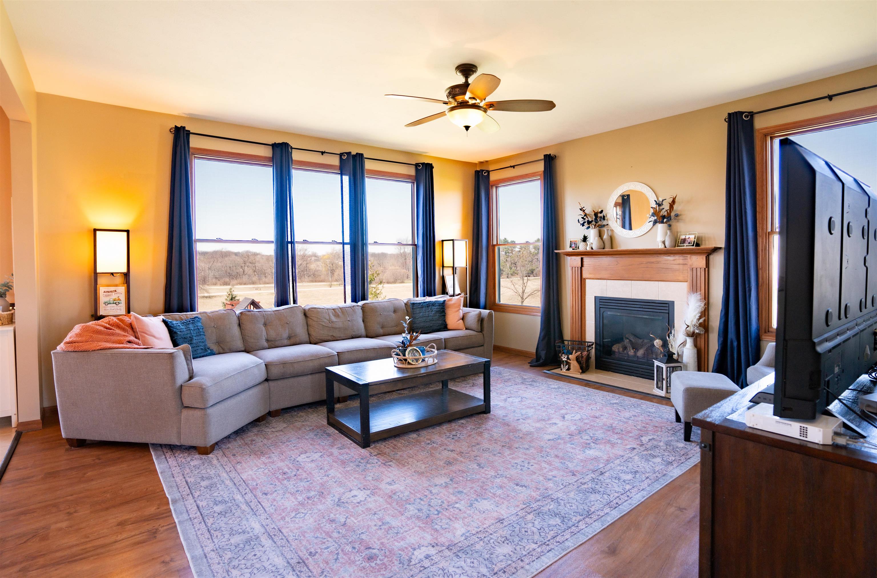314 Brocket Trail Belvidere, IL 61008 - Photo 11 of 46 a living room with furniture a fireplace and a large window