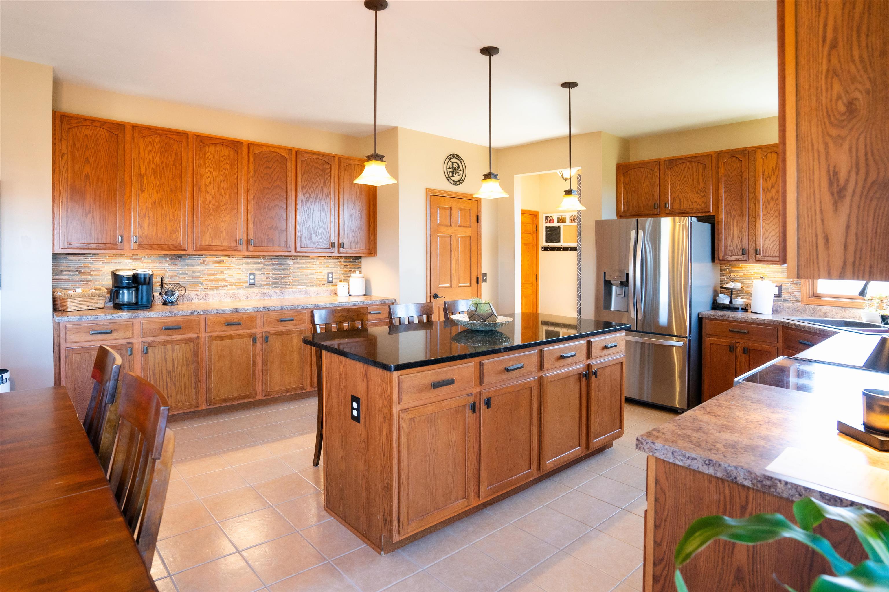314 Brocket Trail Belvidere, IL 61008 - Photo 17 of 46 a kitchen with stainless steel appliances granite countertop a sink a stove and a refrigerator
