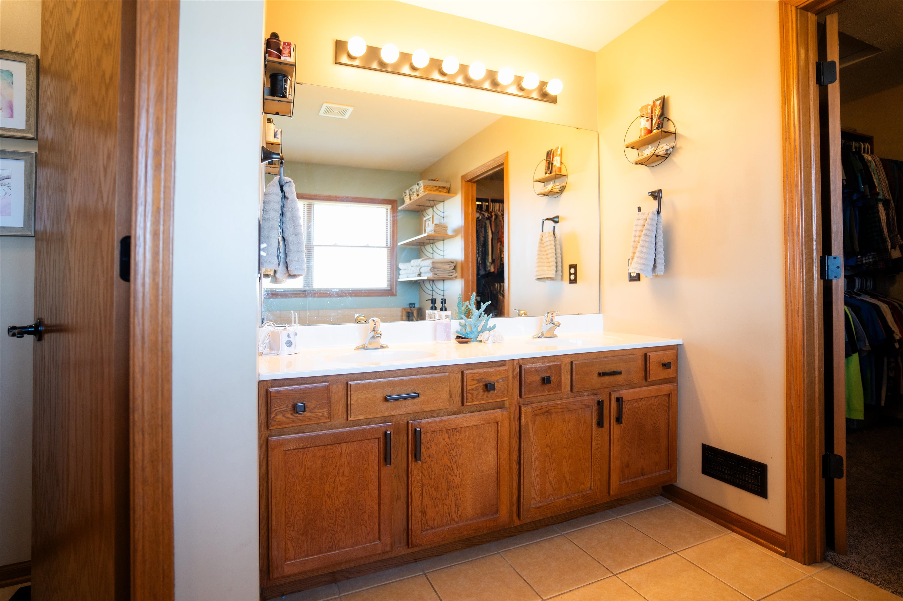 314 Brocket Trail Belvidere, IL 61008 - Photo 22 of 46 a spacious bathroom with a double vanity sink and a mirror
