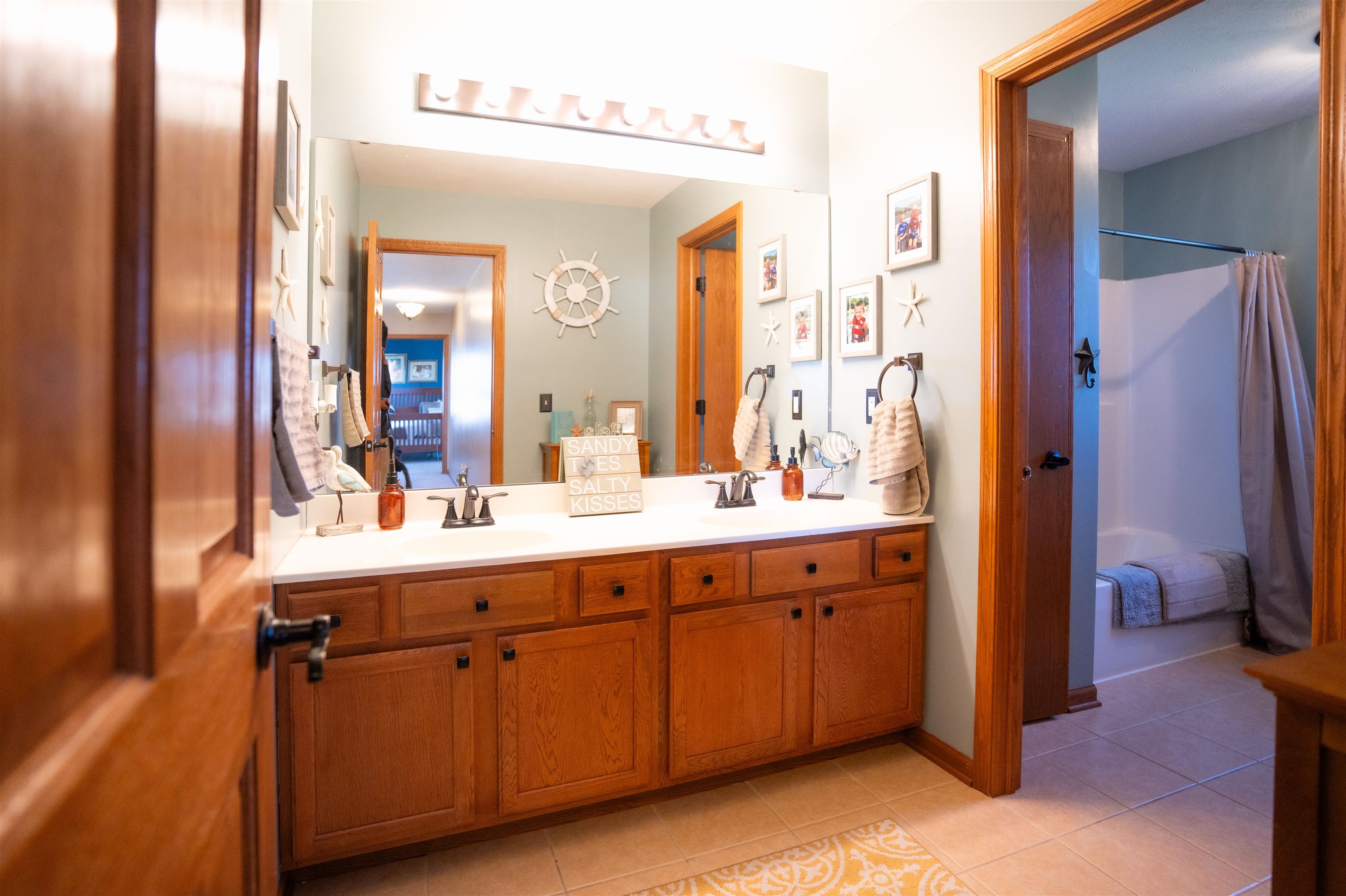 314 Brocket Trail Belvidere, IL 61008 - Photo 26 of 46 a en suite bathroom with a double vanity sink and a mirror