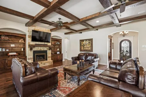 a view of dining room and livingroom with furniture wooden floor a chandelier