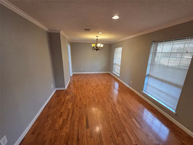 a kitchen with stainless steel appliances a sink stove and cabinets
