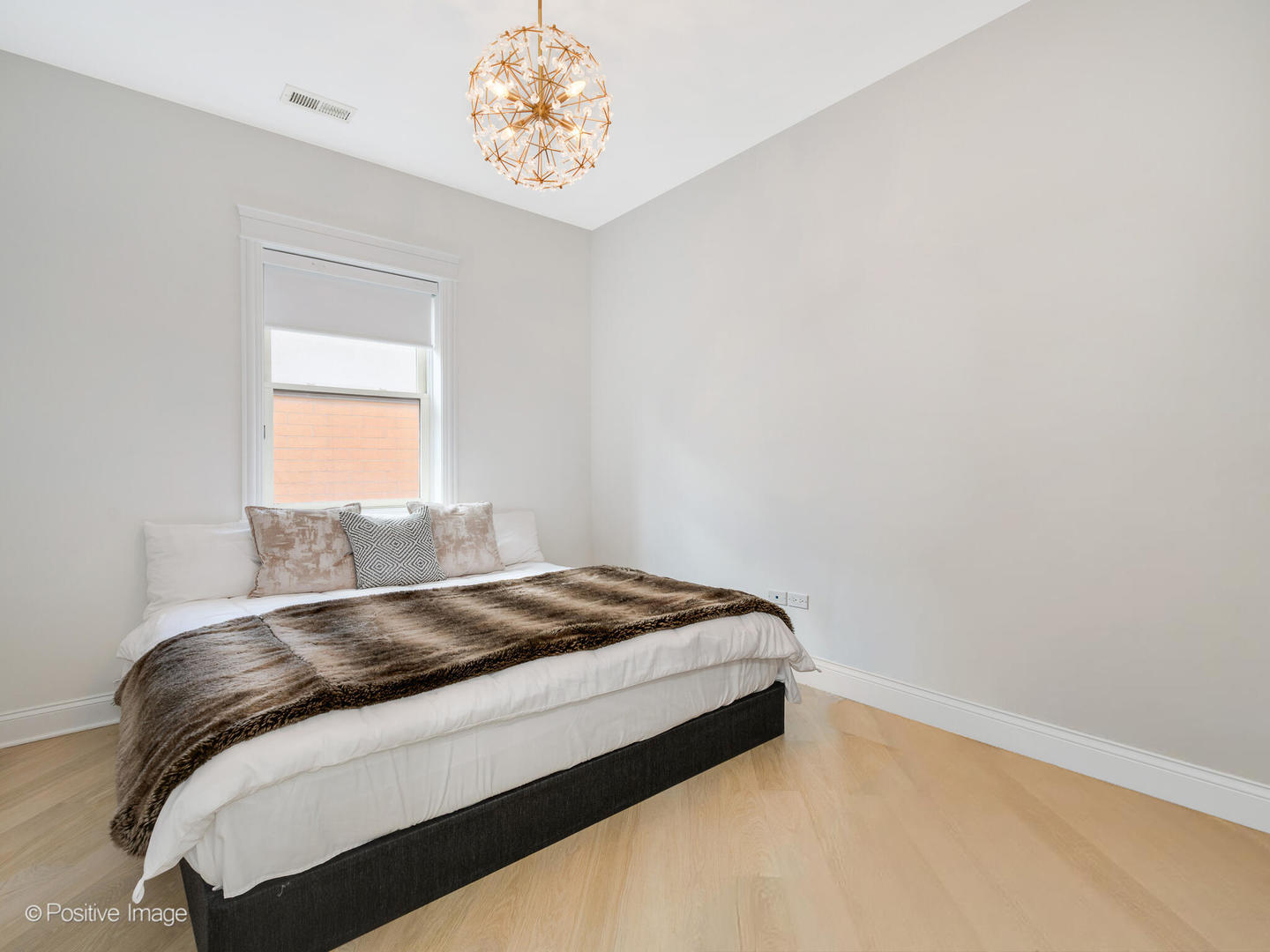 106 South Sangamon Street, Unit 4S Chicago, IL 60607 - Photo 16 of 28 a bedroom with a bed and a window