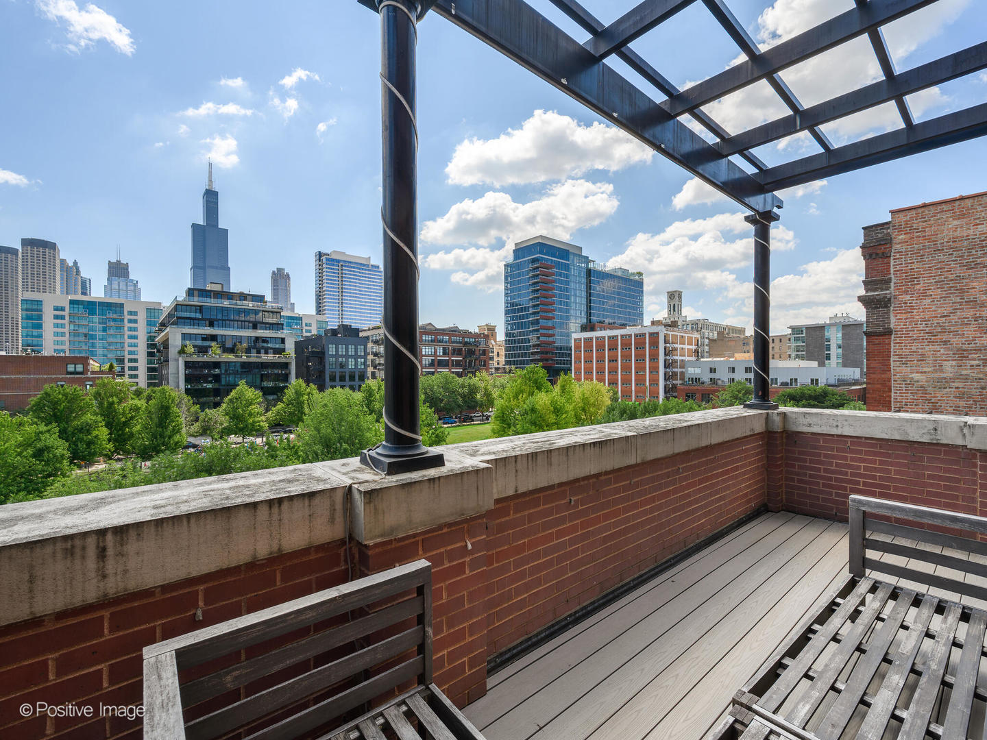 106 South Sangamon Street, Unit 4S Chicago, IL 60607 - Photo 20 of 28 a view of a building from a balcony