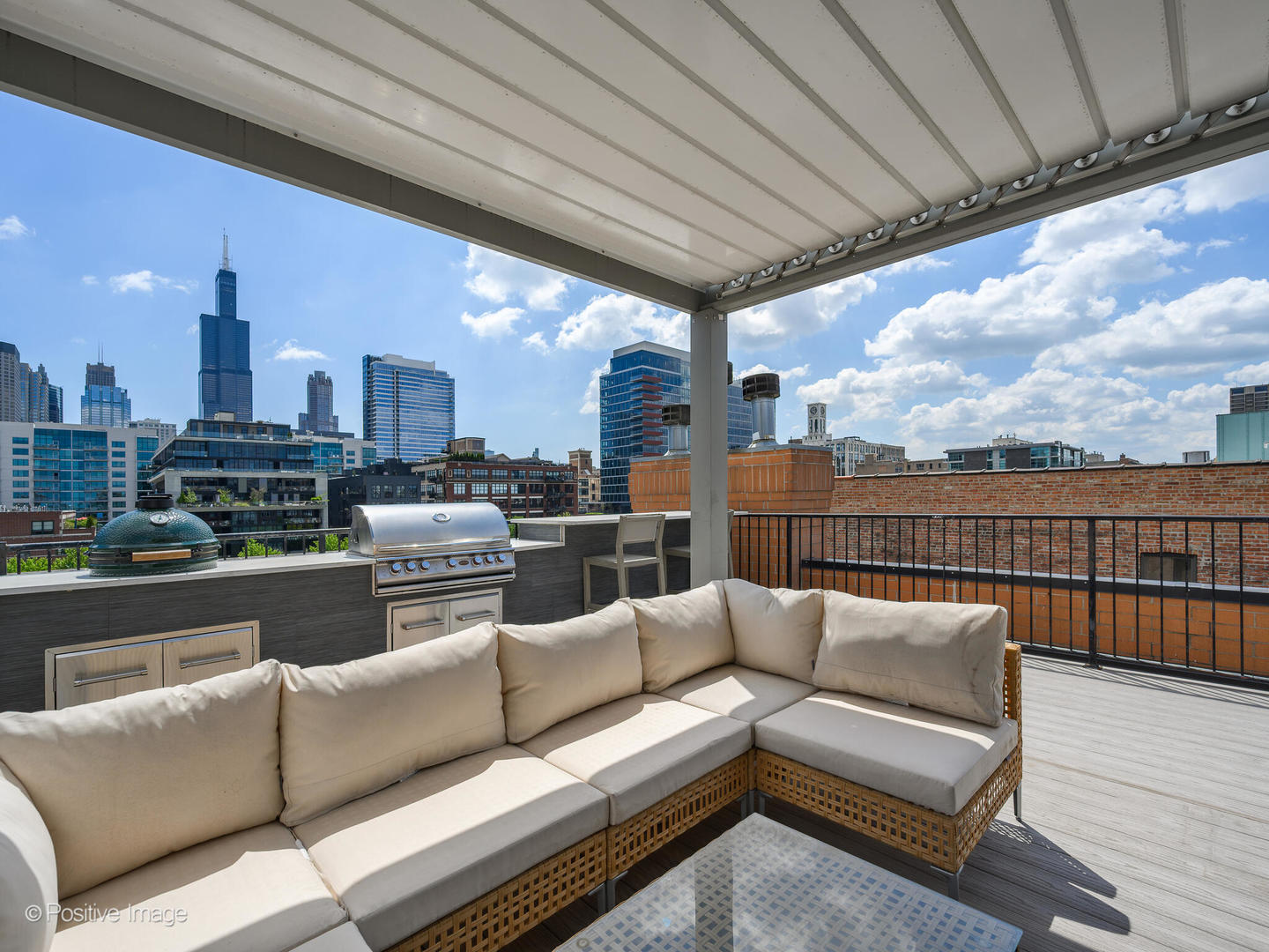 106 South Sangamon Street, Unit 4S Chicago, IL 60607 - Photo 25 of 28 a view of a roof deck with couches and potted plants