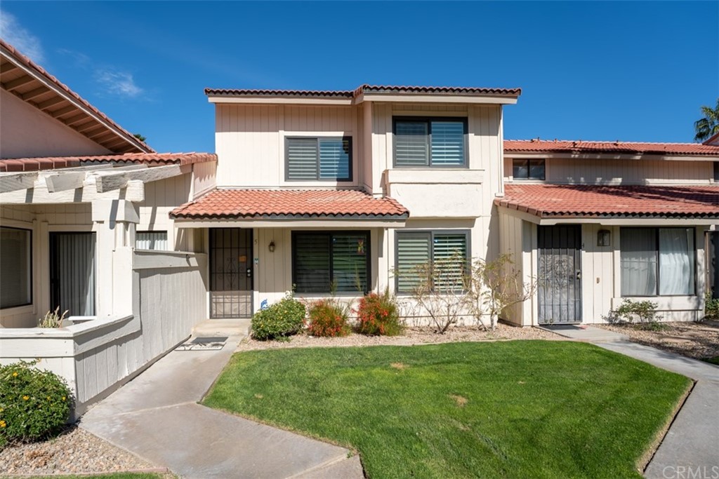 1950 Lawrence Crossley Road, Unit 5 Palm Springs, CA 92264 - Photo 1 of 1 a front view of a house with garden