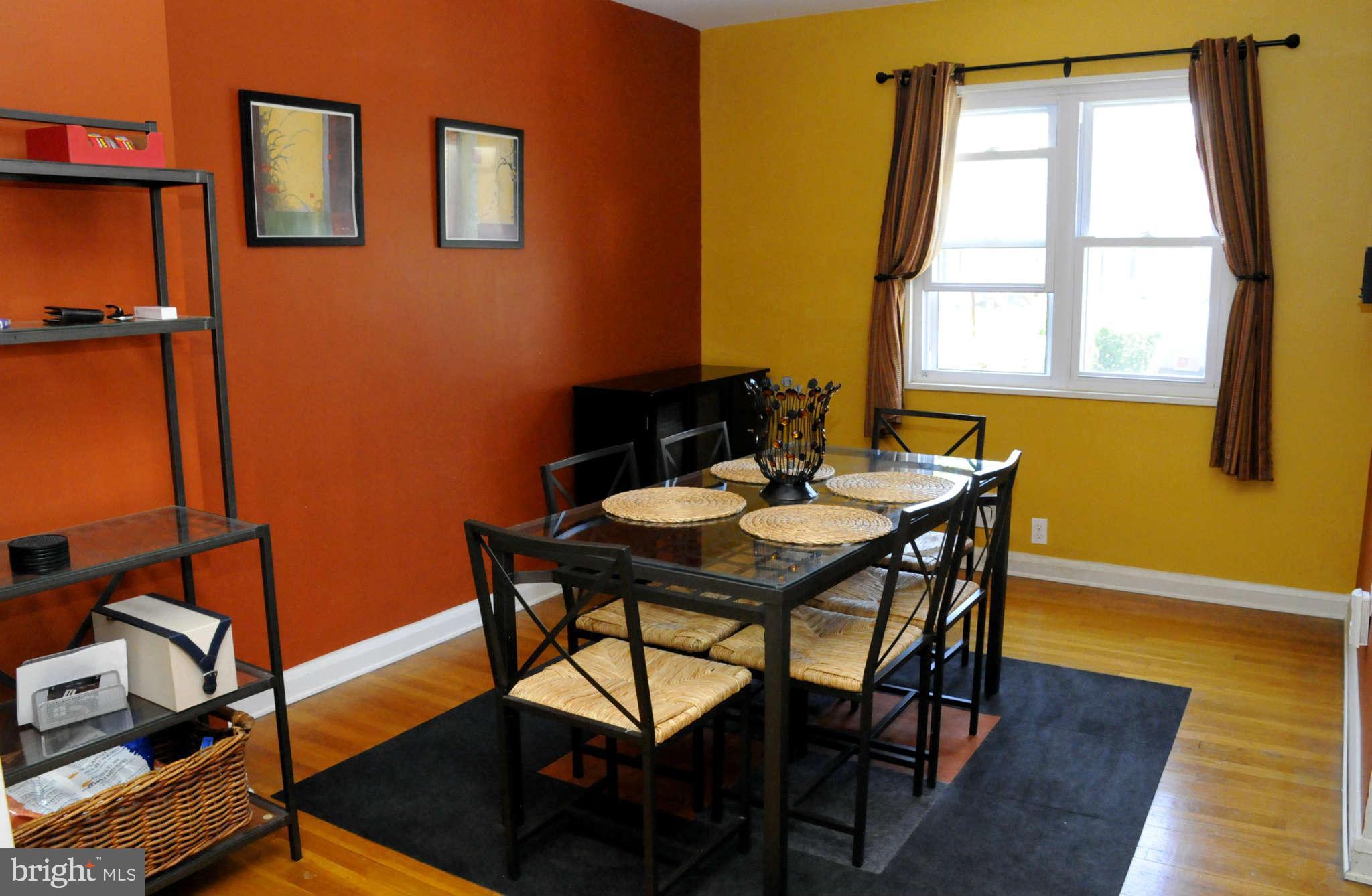 516 Queensgate Road Baltimore, MD 21229 - Photo 11 of 27 a view of a dining room with furniture and window