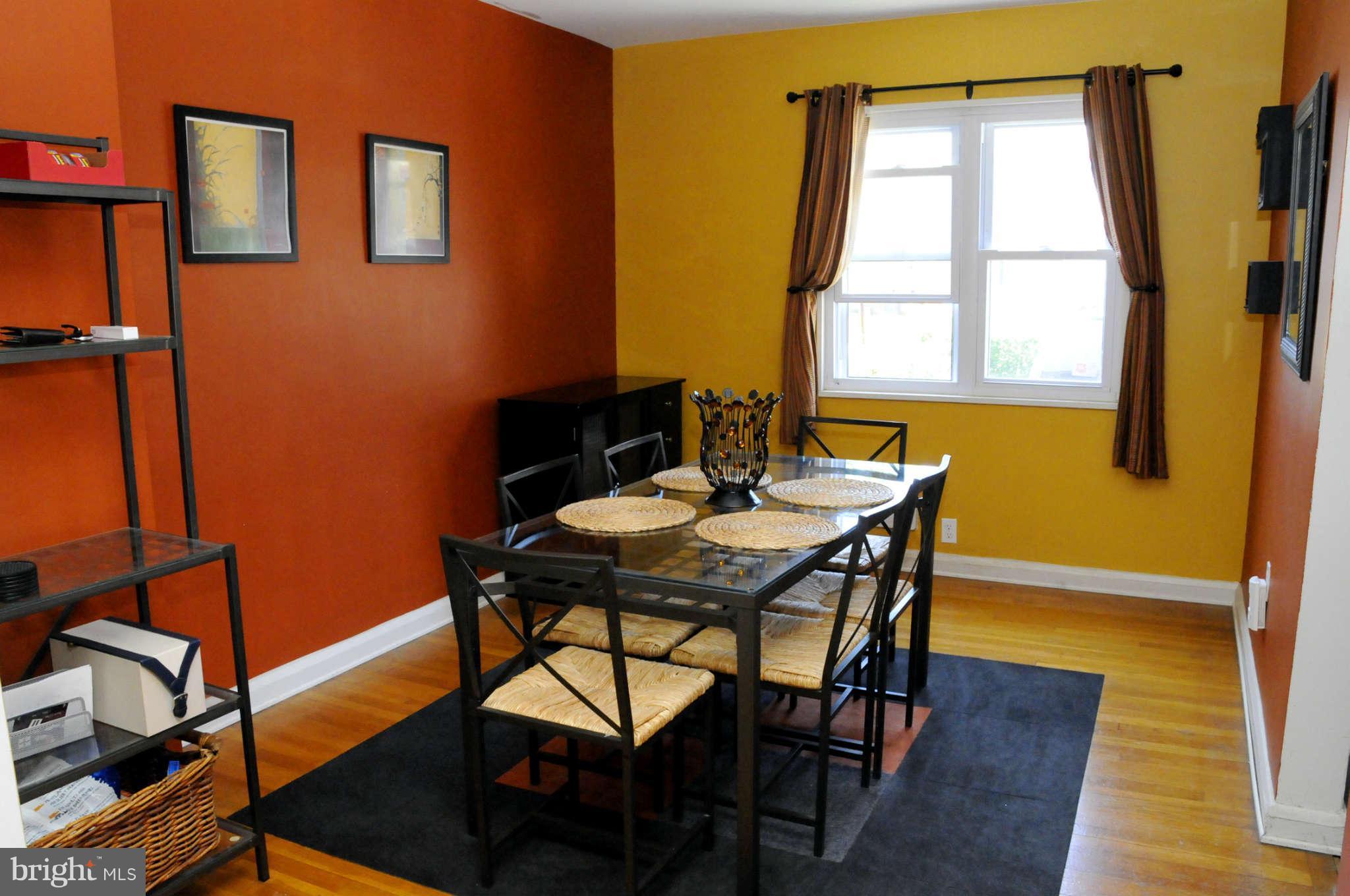 516 Queensgate Road Baltimore, MD 21229 - Photo 12 of 27 a view of a dining room with furniture and a window