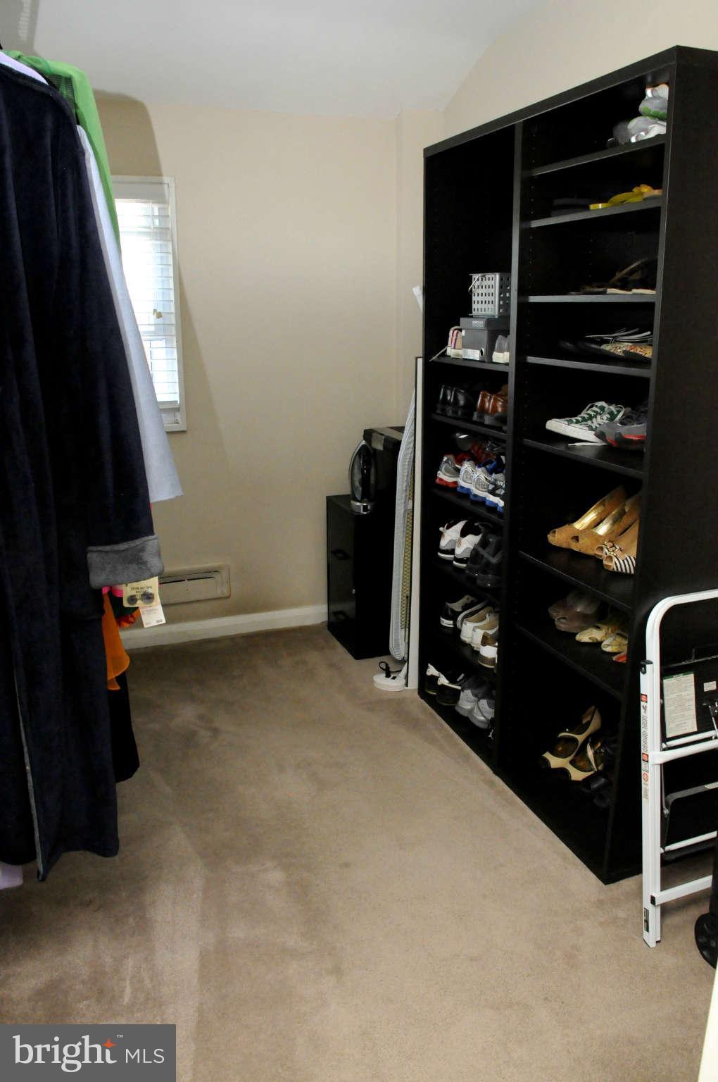 516 Queensgate Road Baltimore, MD 21229 - Photo 17 of 27 a view of walk in closet