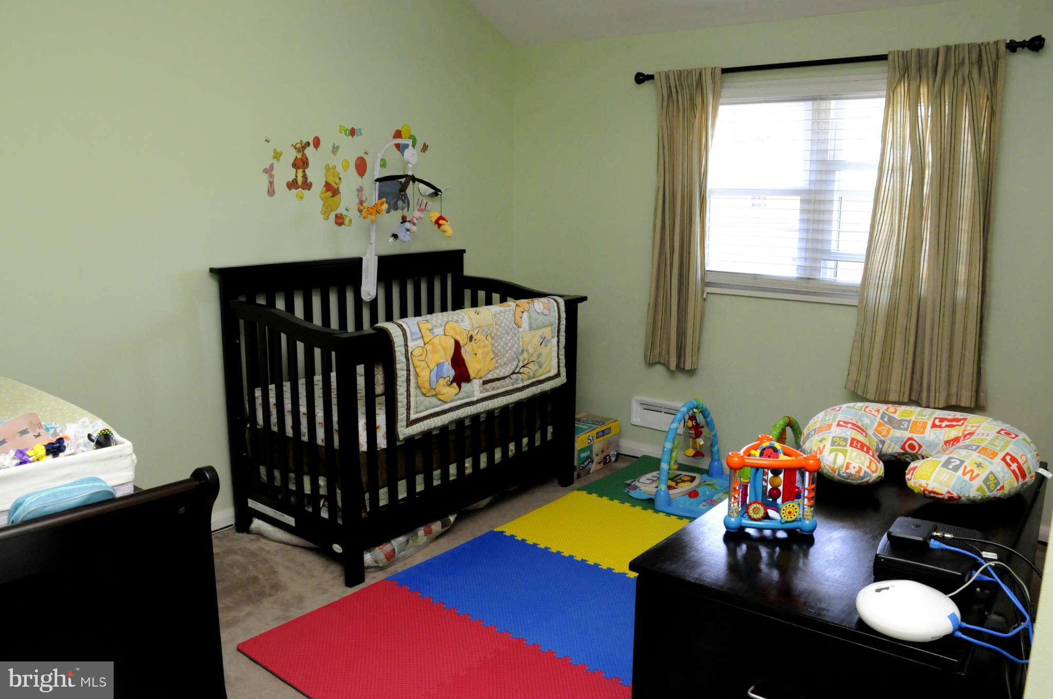516 Queensgate Road Baltimore, MD 21229 - Photo 19 of 27 a bedroom with furniture and a window