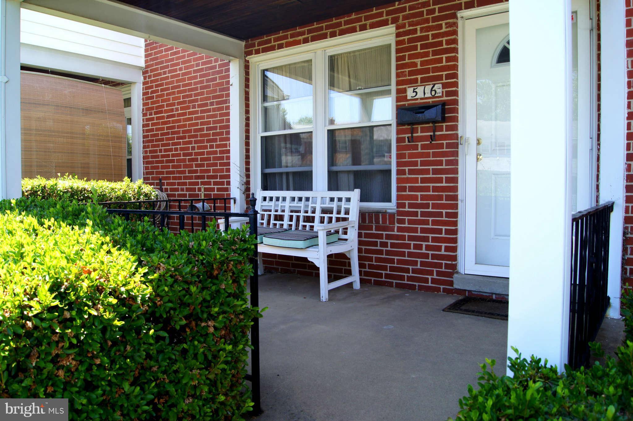 516 Queensgate Road Baltimore, MD 21229 - Photo 23 of 27 a view of front door with outdoor seating