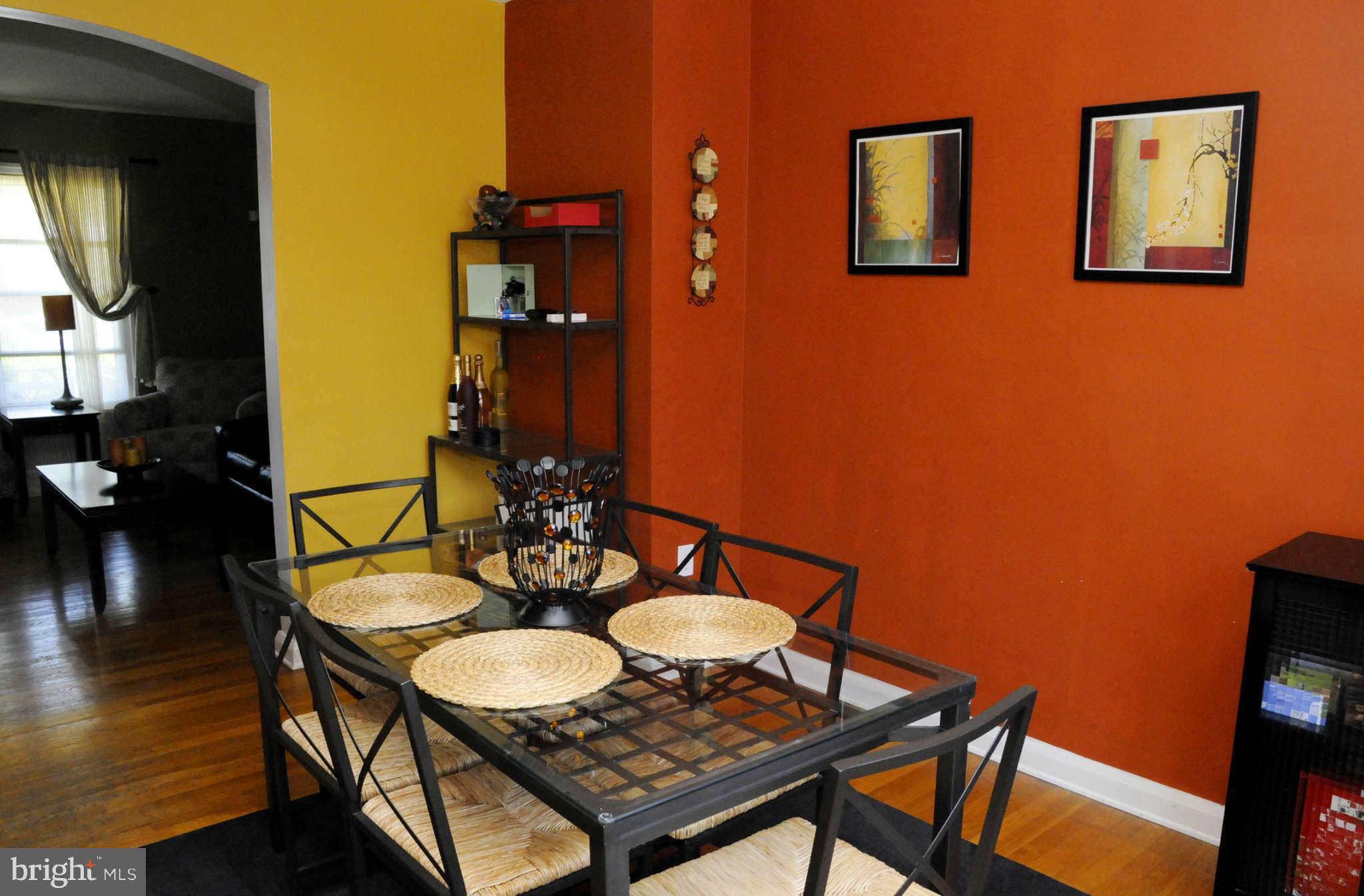 516 Queensgate Road Baltimore, MD 21229 - Photo 9 of 27 a view of a dining room with furniture and wooden floor