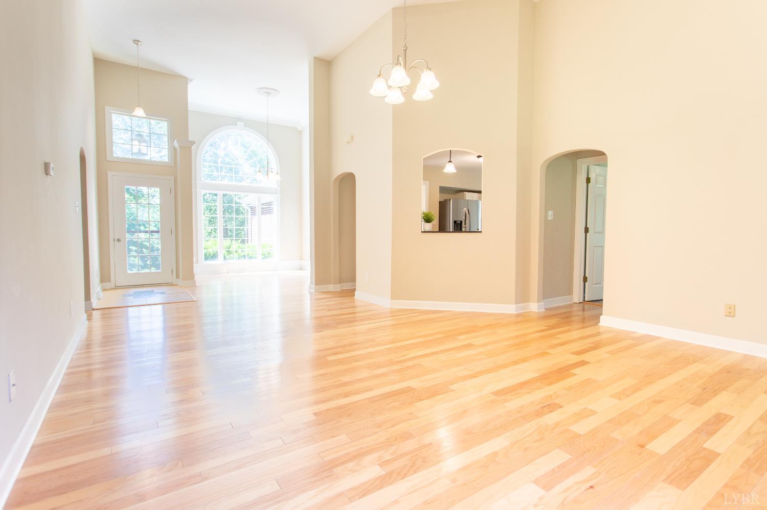 549 Thrashers Creek Road Amherst, VA 24521 - Photo 15 of 66 a view of a room with wooden floor and windows